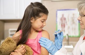 child receiving vaccine at doctors